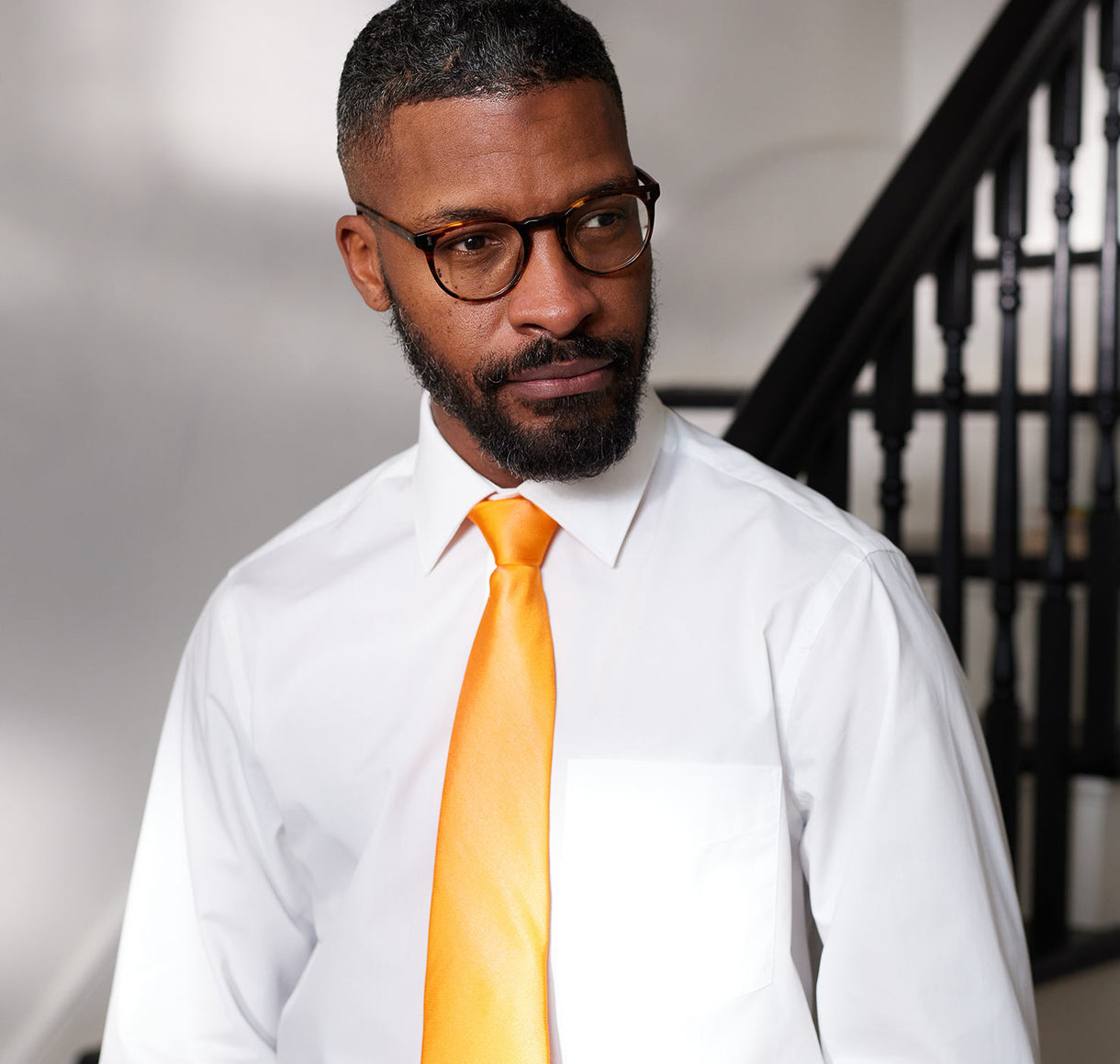 Men's white formal shirt with orange silk tie