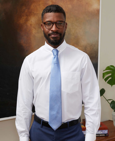 Men's white pin collar shirt and blue silk tie
