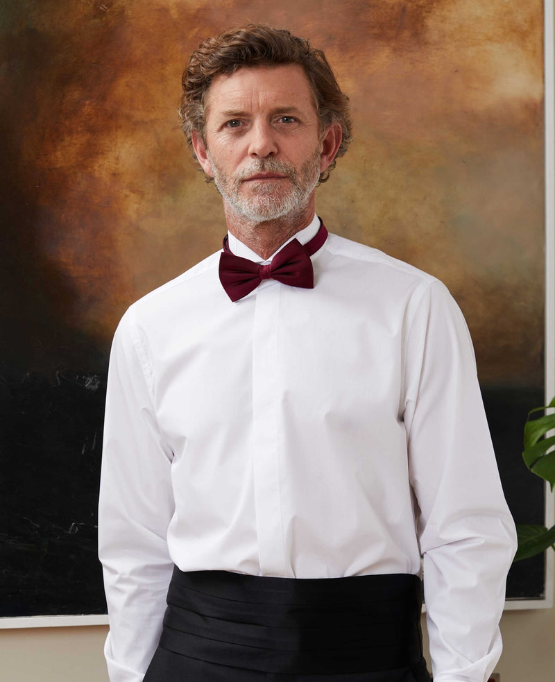Men's white wing collar shirt and burgundy bow tie