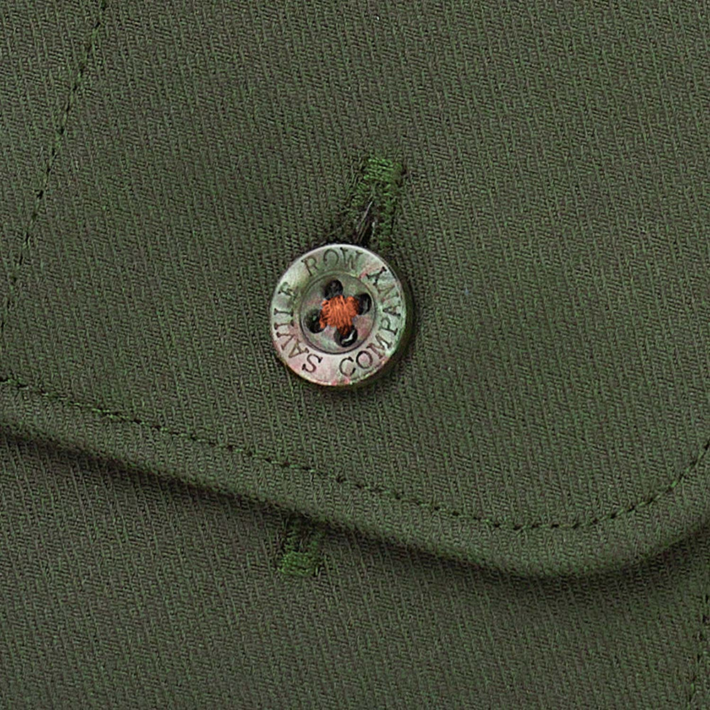 Close up button thread green