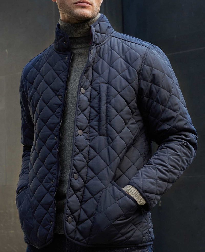 Model wearing navy quilted jacket