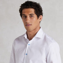 white shirt with contrast blue buttons