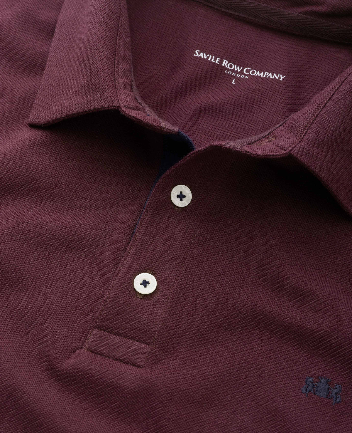 Burgundy short sleeve polo close up