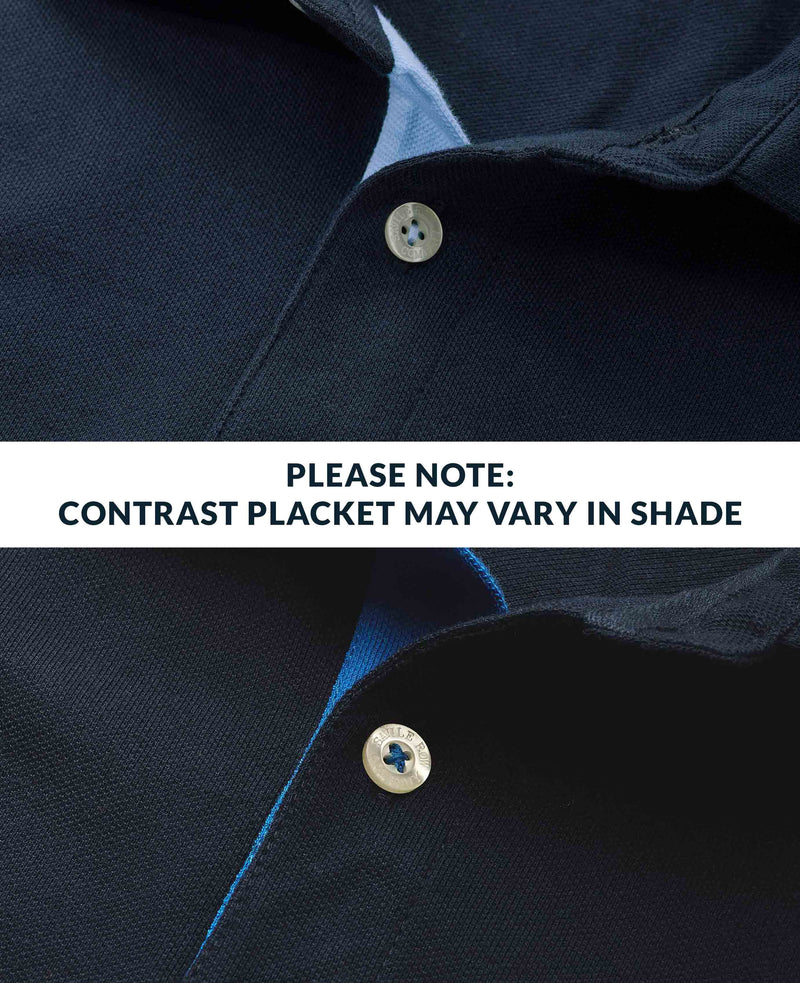 Close-up of a navy shirt with a button and contrasting placket, with text indicating color variation.
