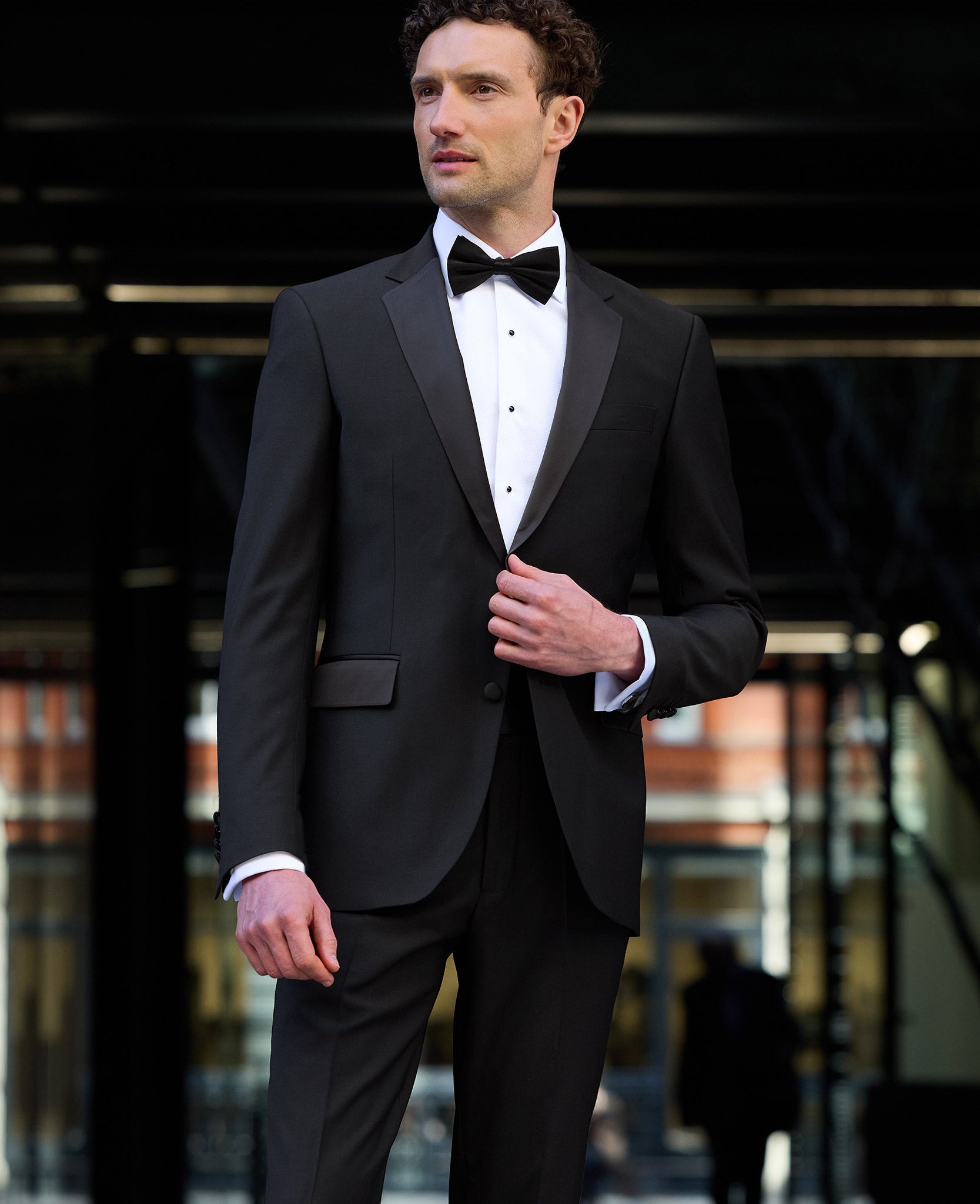 Men's black suits. Tailored by the Savile Row Company