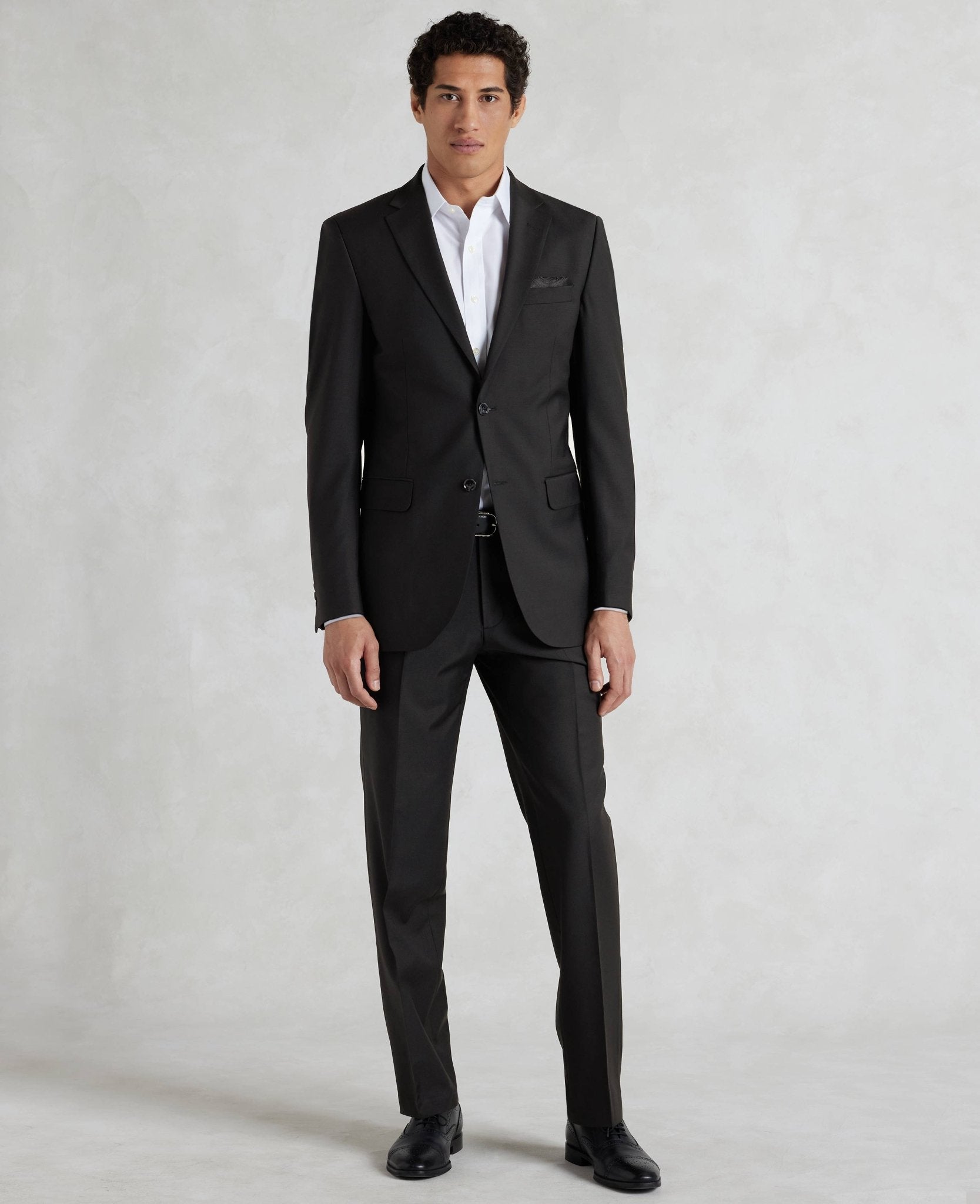Men's black suits. Tailored by the Savile Row Company