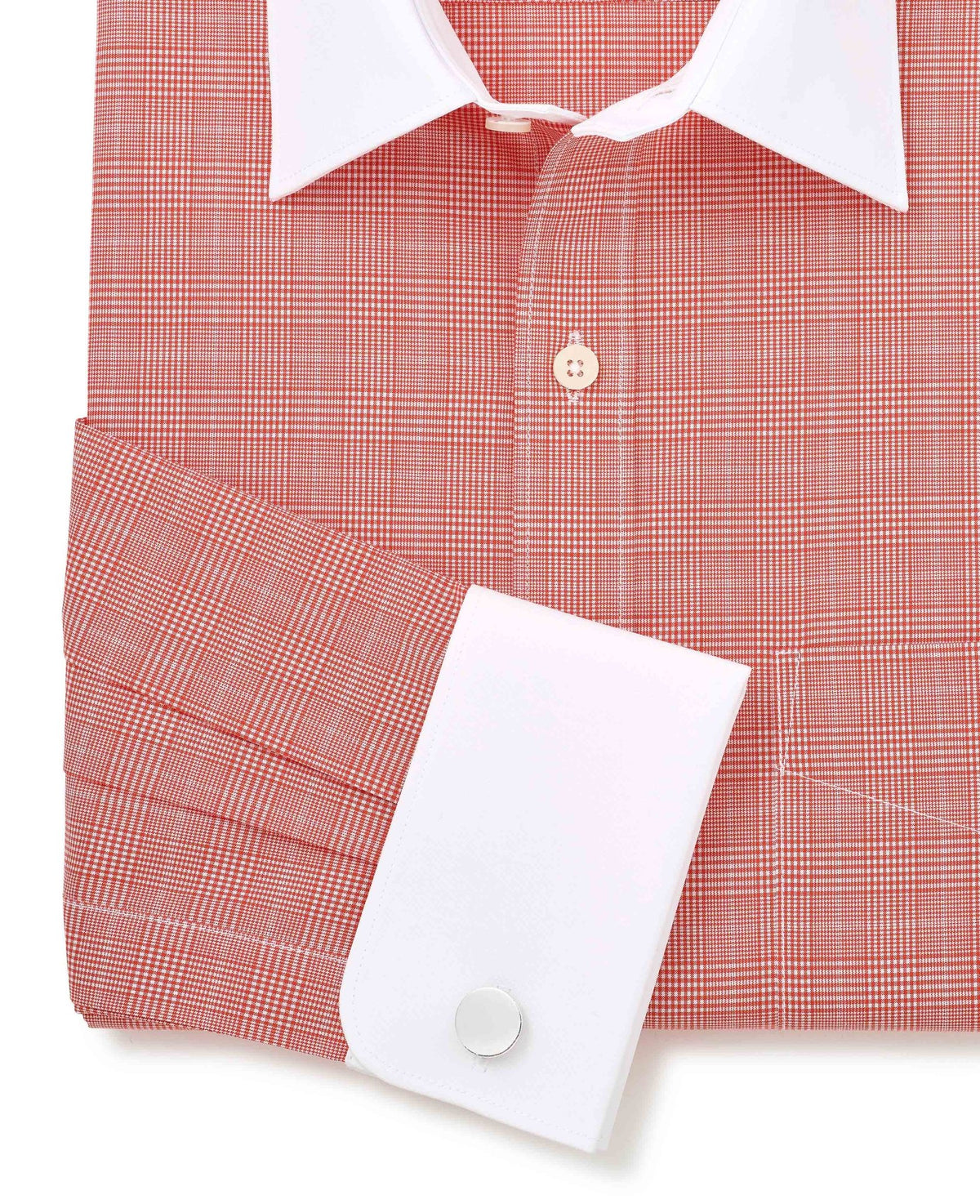 Red checkered shirt with white collar and cuff on a white background. Cuff detail